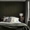 Room styled with Abigail Ahern Fibre Stripe Forest wallpaper in a warm, earthy interior