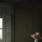 Second room view of Abigail Ahern Fibre Stripe Forest wallpaper with moody, natural deco