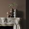 Fireplace wall painted in Abigail Ahern Flaxen Yarn with calming, layered textures