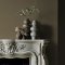 Fireplace wall painted in Abigail Ahern Golden Sky with layered, earthy textures