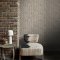 Second room view of Abigail Ahern Heirloom Knit Greige wallpaper with layered, rustic decor