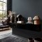 Room styled with Abigail Ahern Herringbone Weave Dusk wallpaper in a moody, elegant setting