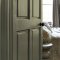 Painted door in Abigail Ahern Neptune Grass with warm, nature-inspired styling