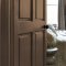 Painted door in Abigail Ahern Owasco Olive with warm, layered styling
