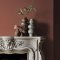 Fireplace wall painted in Abigail Ahern Rocky Desert with layered natural textures