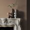 Fireplace wall painted in Abigail Ahern Sandstone Shadow with warm, layered textures