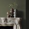 Fireplace wall painted in Abigail Ahern Seagrass Meadow with rustic, grounded decor