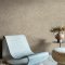 Second room view of Abigail Ahern Urbanite Tadelakt Buff wallpaper with warm, elegant decor