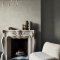 Second room view of Abigail Ahern Urbanite Tadelakt Greige wallpaper with soft, neutral décor