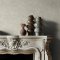 Room styled with Abigail Ahern Urbanite Tadelakt Greige wallpaper in a cool, minimalist setting