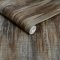 Roll shot of Abigail Ahern Wanderlust Amber wallpaper showing soft shimmer and fibre texture