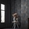 Second room view of Abigail Ahern Wanderlust Ink wallpaper with layered, atmospheric decor