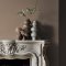 Fireplace wall painted in Abigail Ahern Weathered Linen with natural, layered textures
