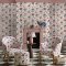 Room decorated with Cowgirls Pink wallpaper, featuring cowgirls, cacti, and wagons in a vibrant pink colour palette