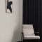 Interior room painted in Craig & Rose Exposition Gris with warm, neutral styling