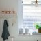 Room painted in Craig & Rose Pale Celadon with serene, minimalist styling