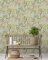 Paul Moneypenny Floral Hall wallpaper styled in a modern room with vibrant tropical print and soft green tones.